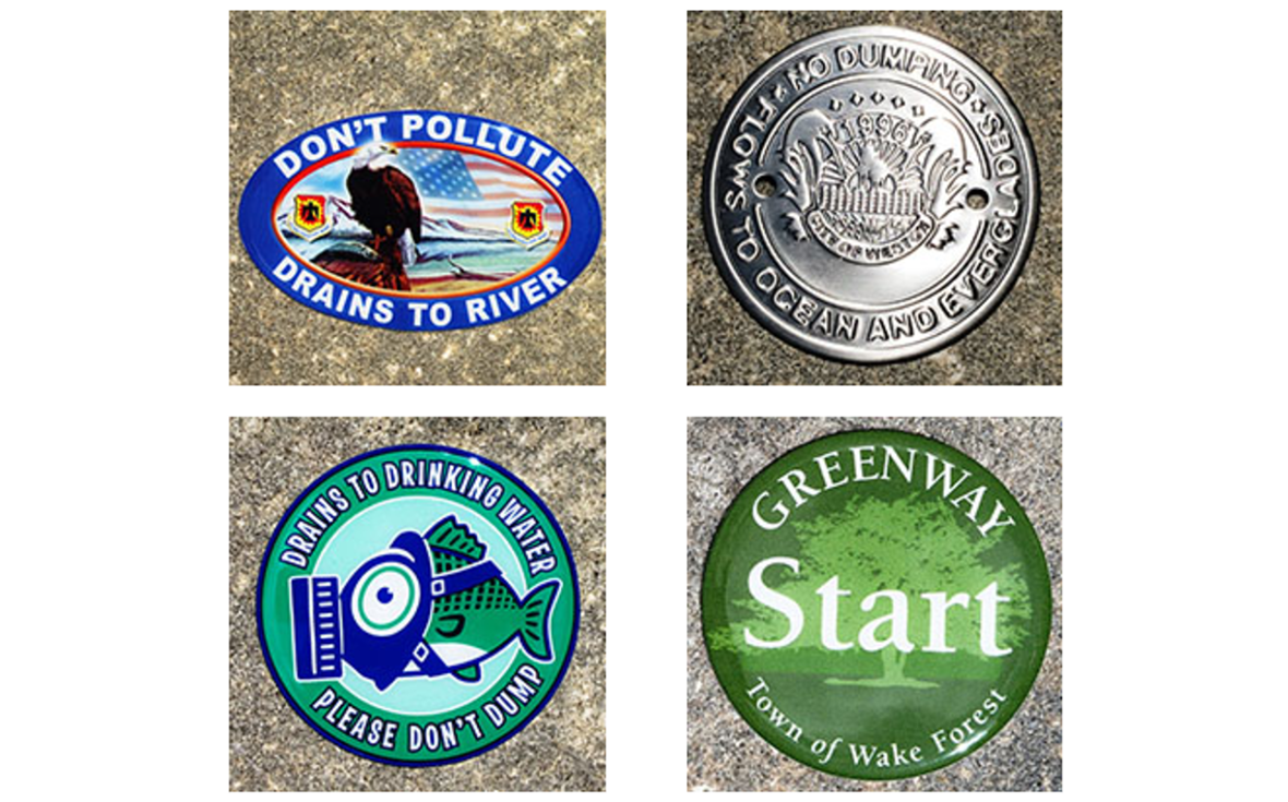 Four environmental warning drain markers.